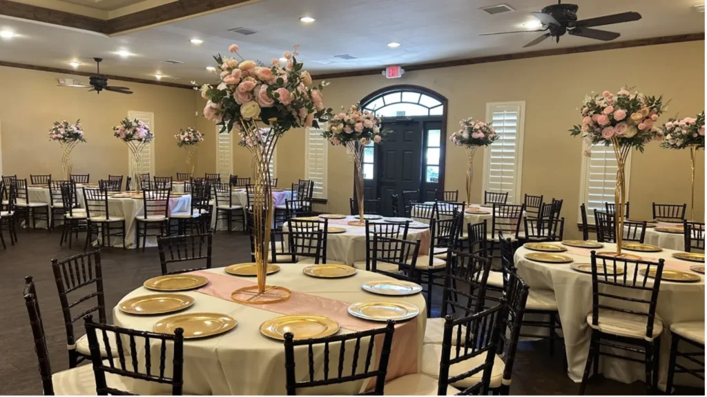 FAQ page hero image showing The Glitz Plano event venue with guest tables, chairs, floral centerpieces, and open seating layout